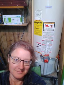 Me posing next to the water heater